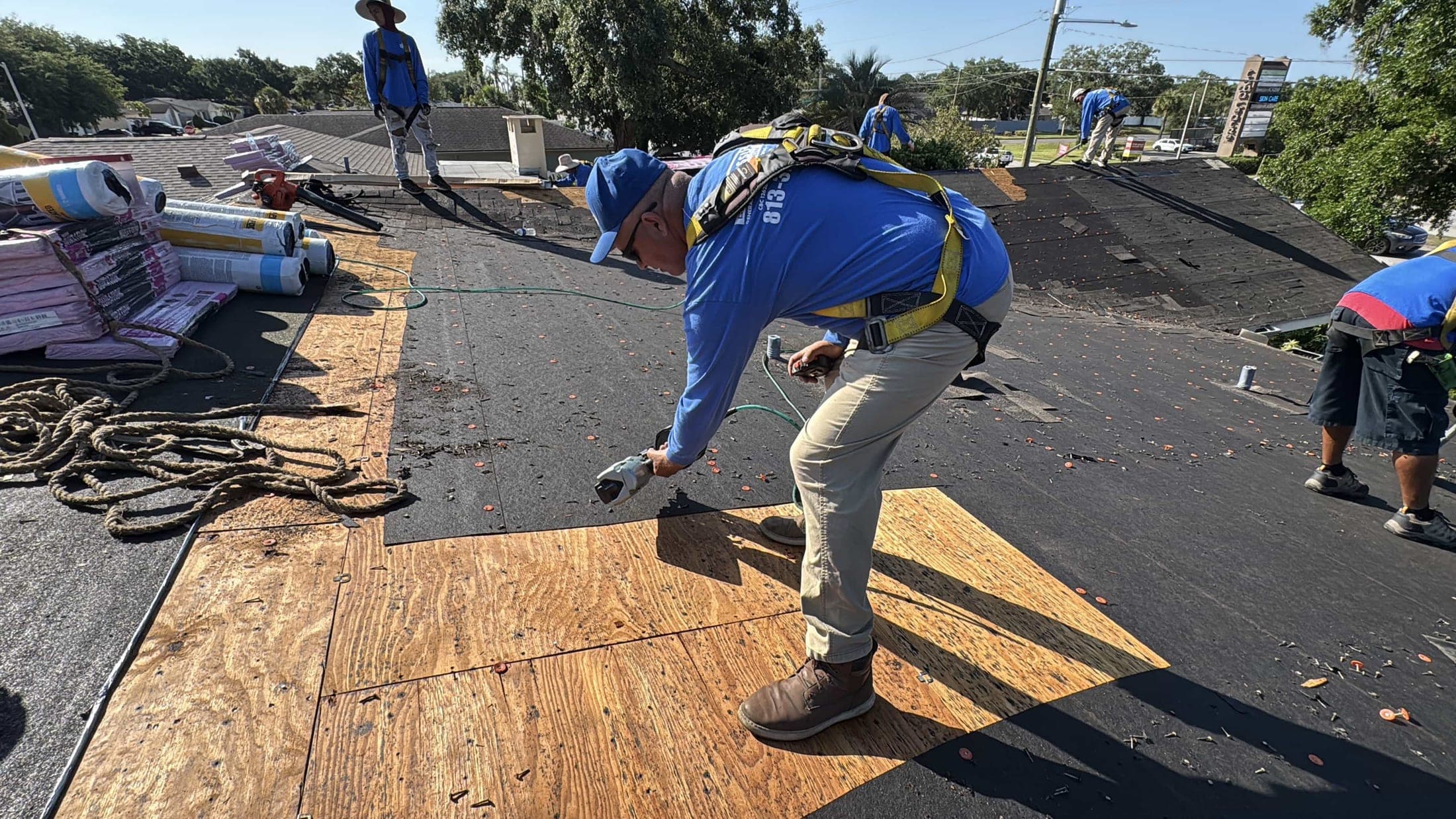 Roofing crew during a tear-off on a Tampa Bay home