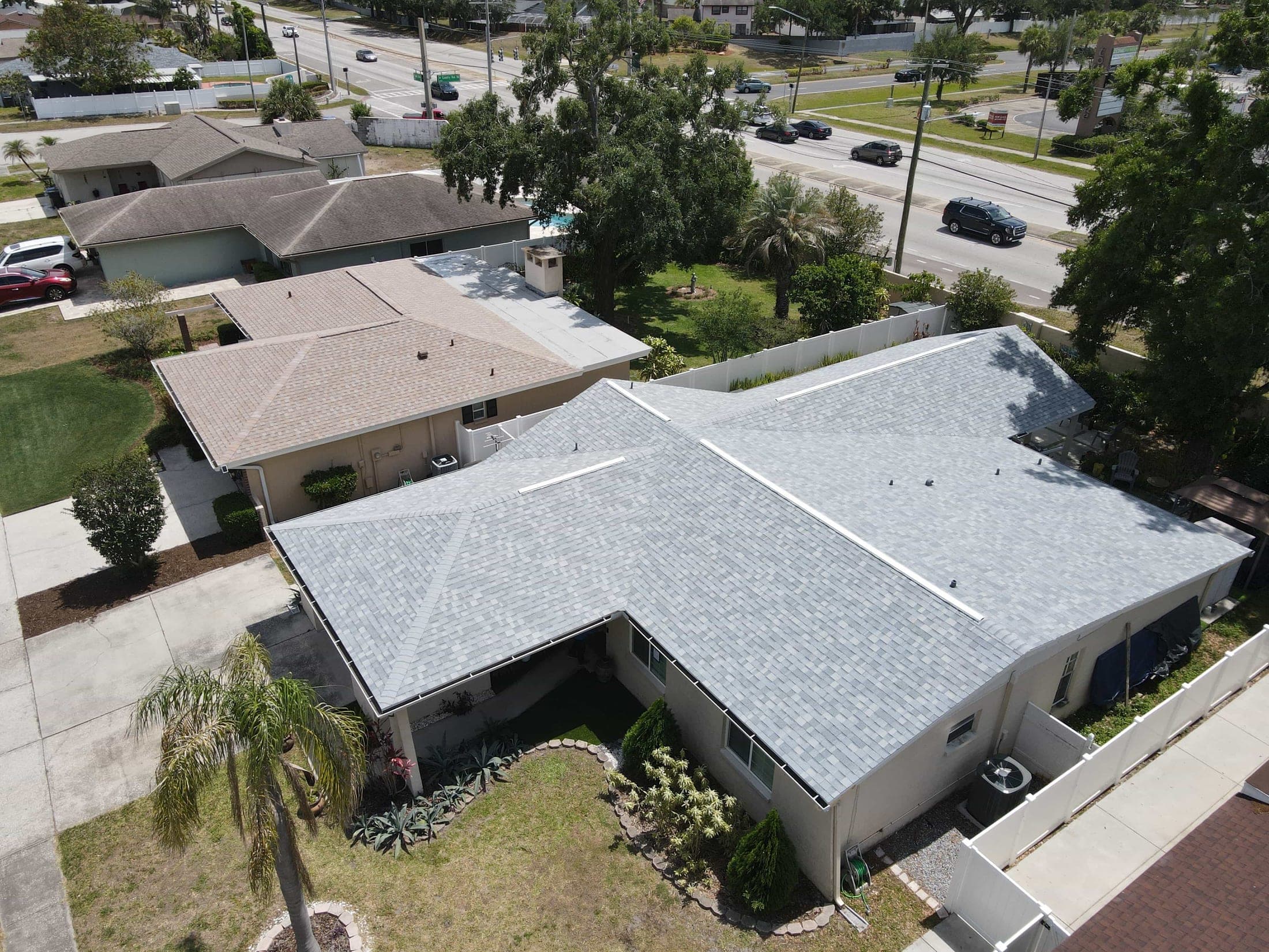 Finished: the completed architectural shingle roof, two days after tear-off began.
