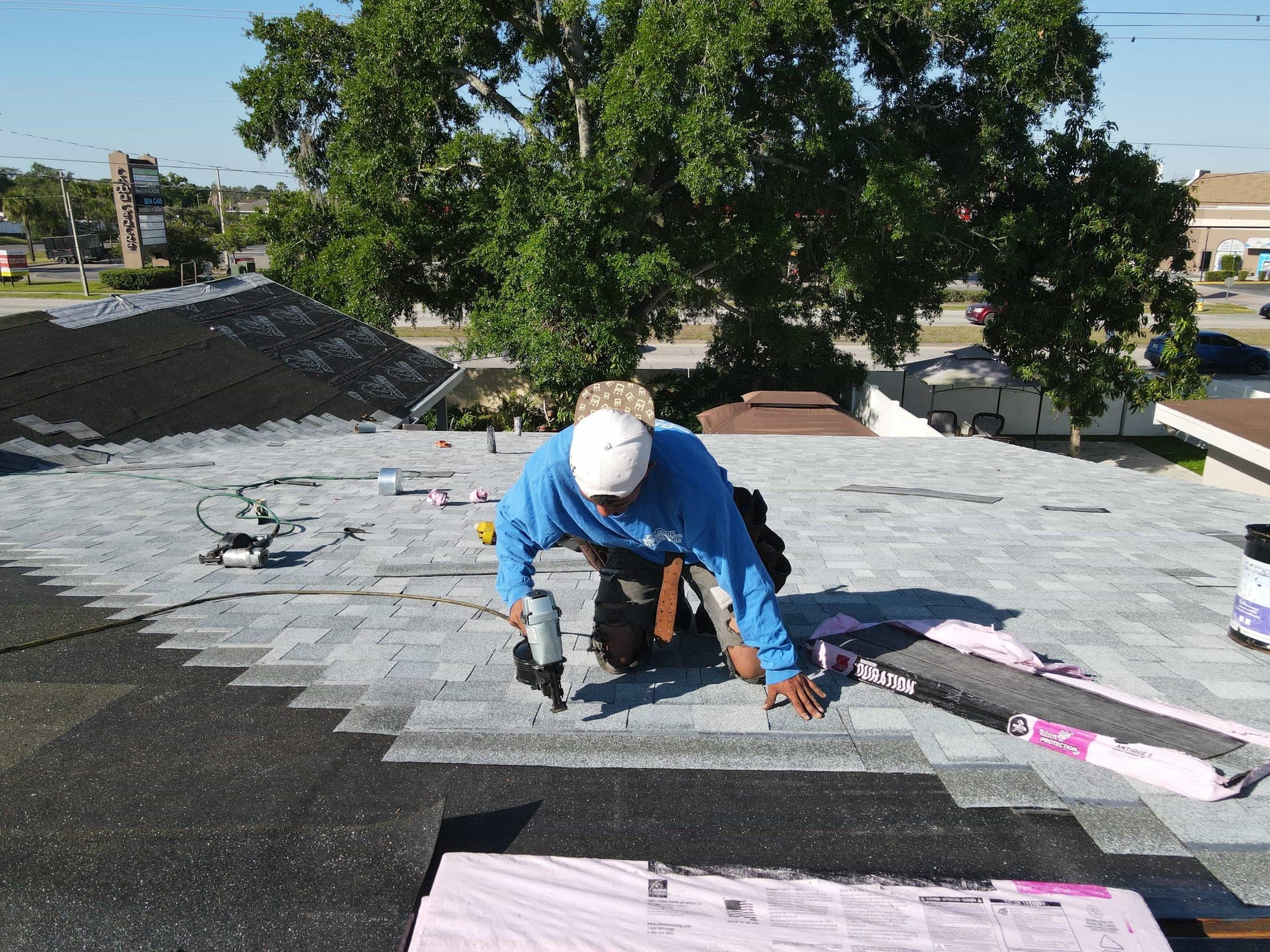 Installing the architectural shingle field, six nails per shingle to Florida code.
